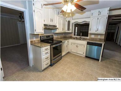 Updated Kitchen with granite countertops, tile flo