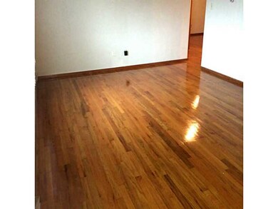 Living Room. Newly restored hardwood floors in the