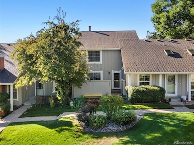 Front entrance with lots of greenery and a welcoming private front patio.