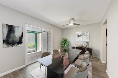 Dining space with wood finished floors, a ceiling