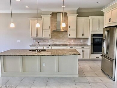 Kitchen with appliances with stainless steel finis