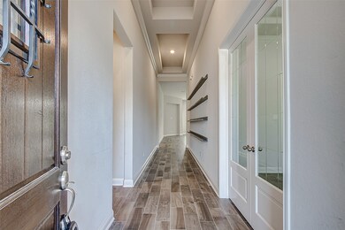 Large foyer with upgraded office doors on the right.