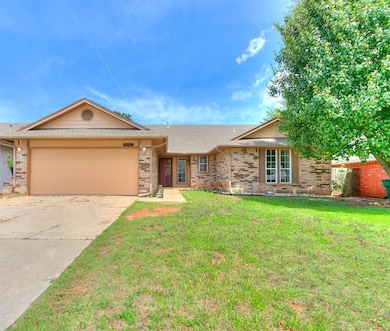 Ranch-style house featuring a garage and a front l