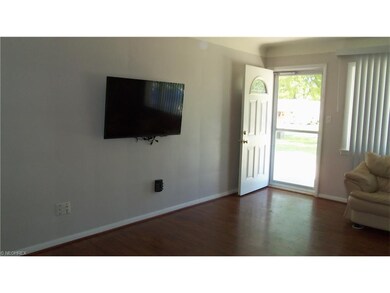 Enjoy wood-like flooring in this open floor plan r