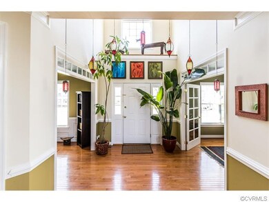 The entrance foyer is open to the second floor.