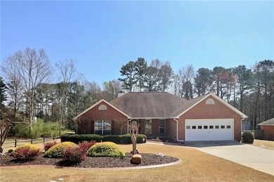 View of front of property with brick siding, a chi