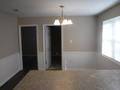 9x12 dining area with doors to laundry r