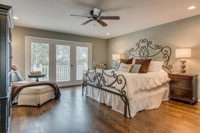 Spacious owners suite with sand/finish HDWD floors. French doors open to private deck.