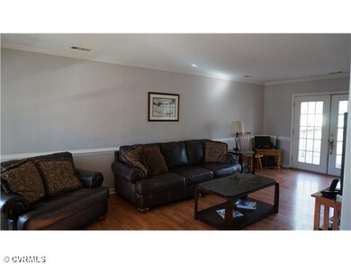 Den/Family/Great Room - Wood laminate floors, over