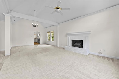 Unfurnished living room with light colored carpet,