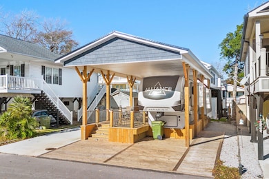 View of front facade with a carport