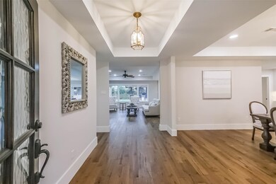 Enter through a beautiful glass door into this lig