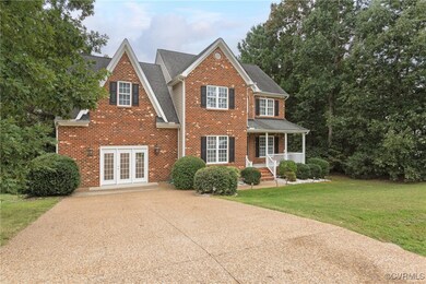 View of front of home with french doors, a front l