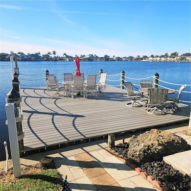 Dock featuring a deck with water view