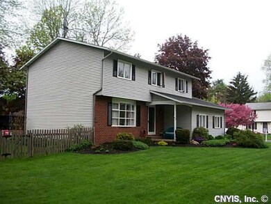 Exterior Front. Set on a corner lot and with mature landscaping, it looks attractive throughout the different seasons.