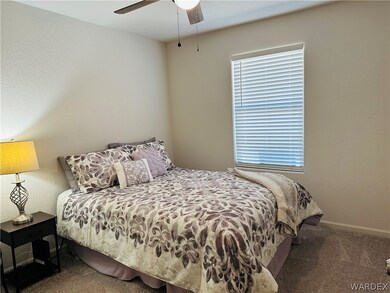 Bedroom with carpet and ceiling fan