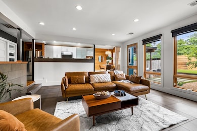 Living room with recessed lighting, baseboards, a