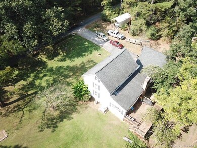 Farmhouse has lots of level yard for gardens, pets, playing and boats!