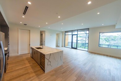 Kitchen featuring dishwasher, light wood-style fl