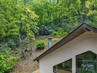 4+acre property features large rock outcropping above the house.
