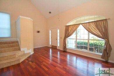 Formal living room, gorgeous wood floors, vaulted 