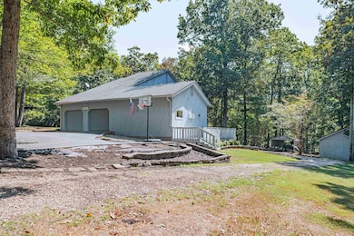 View of front of property with a garage and a fron