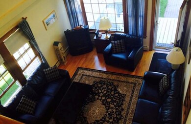 View of livingroom from upstairs balcony