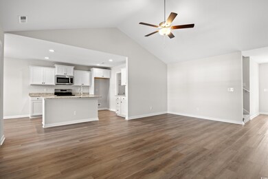 Unfurnished living room featuring ceiling fan, rec