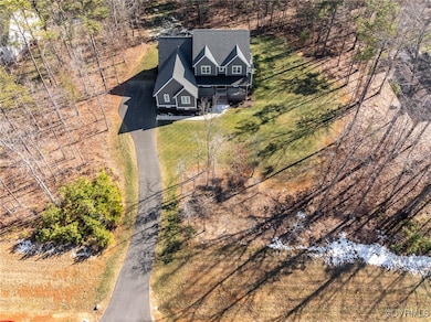 View of house from the road w deep front lawn.