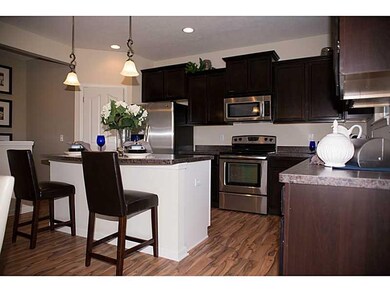 Kitchen. Photo is of a similar model & floor plan.