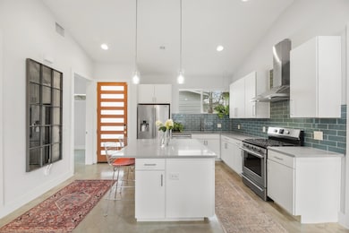 Kitchen with a kitchen breakfast bar, visible ven