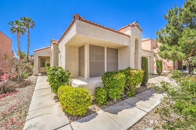 View of front of home featuring a tiled roof and s