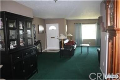 Entry into the formal living room w/ fireplace.