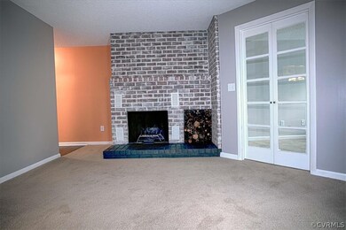 Living Room with brick fireplace