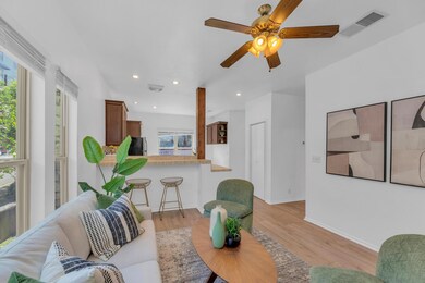 Living area featuring plenty of natural light, li