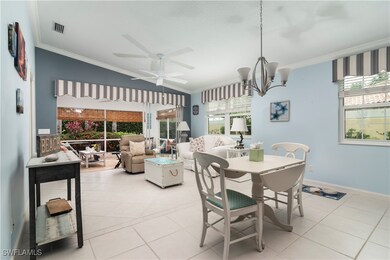 Dining space with ornamental molding, light tile p