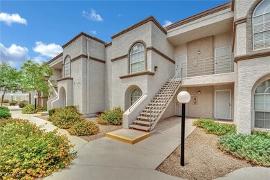 View of front of home with stucco siding and stair