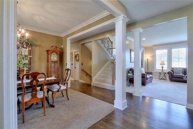 HARDWOOD FLOORS IN FOYER EXTENDING DOWN HALL TO KI