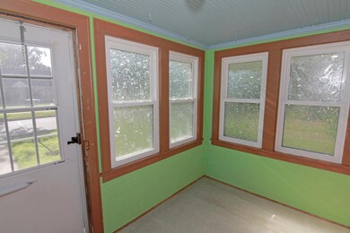 Front porch with newer windows.