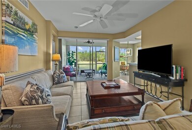 Tiled living room with ceiling fan with notable ch