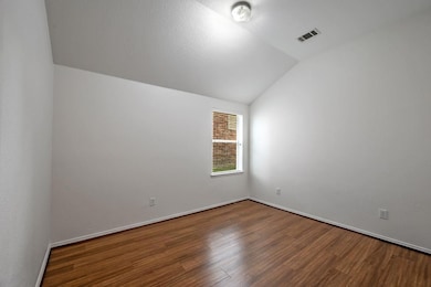 Spare room featuring hardwood / wood-style floors 