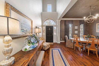 As you enter, be greeted by a grand entryway with