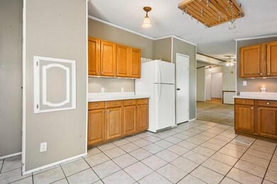 06_3654WShawneeRd_91001_KitchenLiving_Lo