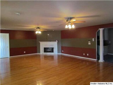 Spacious family room with gleaming hardwoods and g