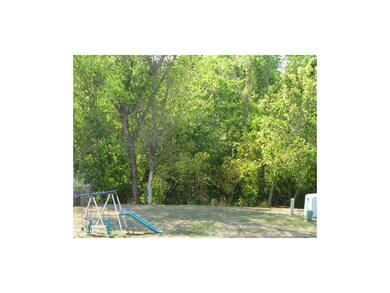 Very large back yard with treed greenspace behind