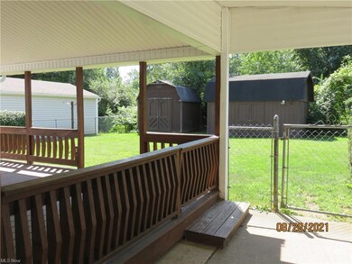 Carport to deck. Plenty of room for outdoor entert