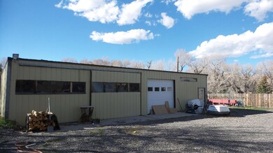large shop with 3 doors and storage area