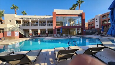 Community pool with a pergola, fence, and a patio