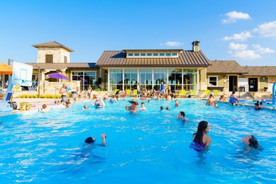 Community pool featuring a sunroom