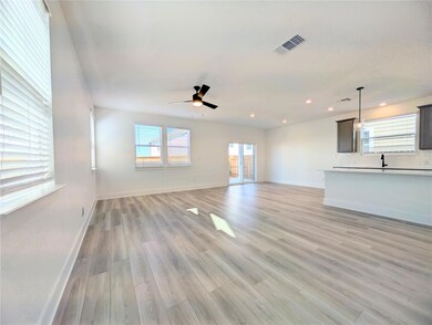 Unfurnished living room with light wood-style flooring, a ceiling fan, and recessed lighting